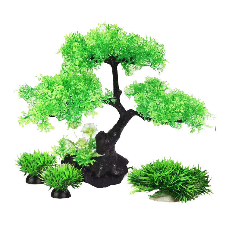 Artificial green tree and grass set on a white background