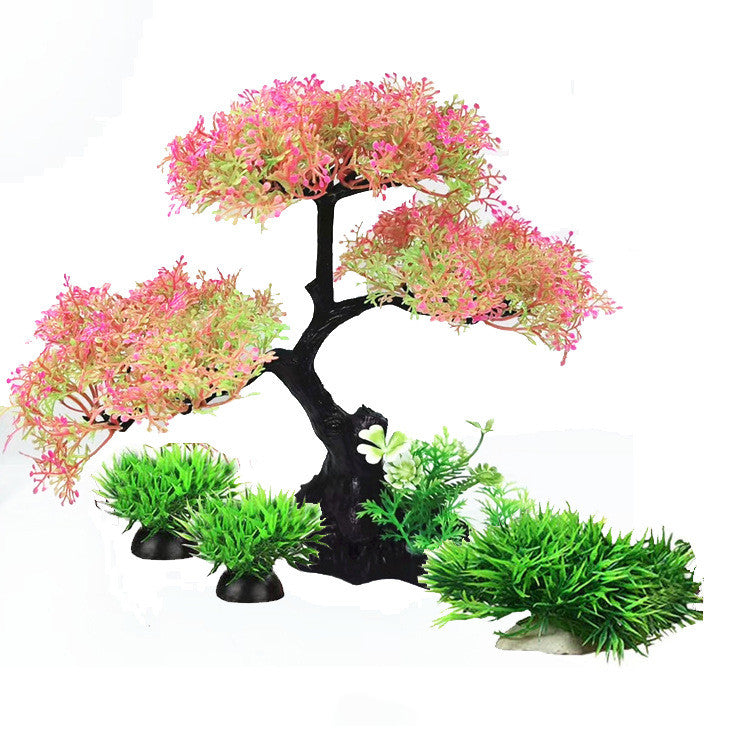 Artificial aquarium plant with pink and green leaves on a white background