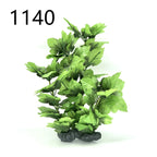 Artificial green plant with rocks on a white background, labeled '1140'.