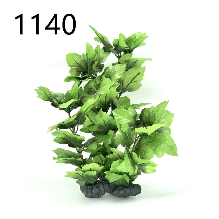 Artificial green plant with rocks on a white background, labeled '1140'.