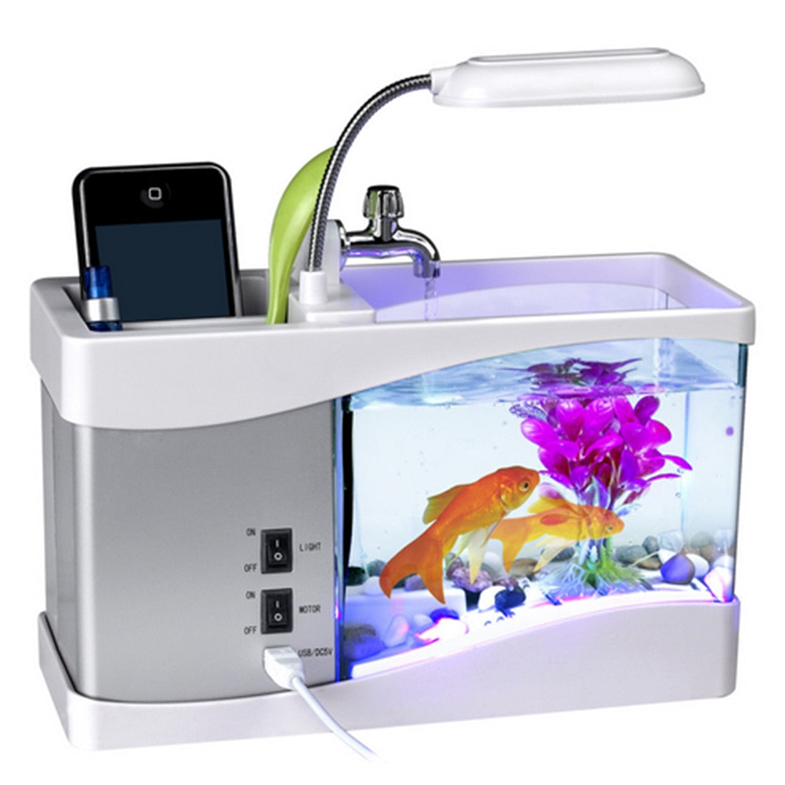 Small aquarium with fish, lamp, and phone on a white background