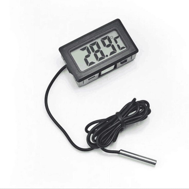 Digital thermometer with probe on a white background