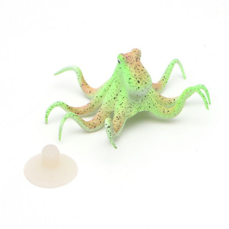 Green and brown squid-like toy on a white background