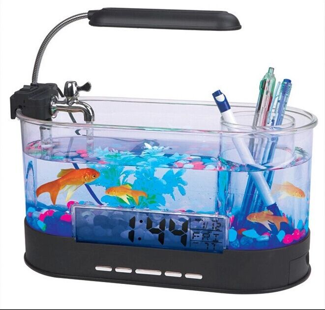 Desk organizer with aquarium, fish, and stationery items on a white background